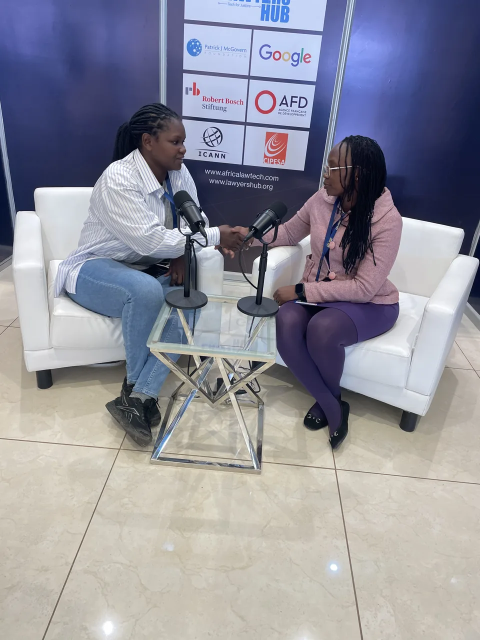 Two participants in conversation at the Africa Law Tech Festival