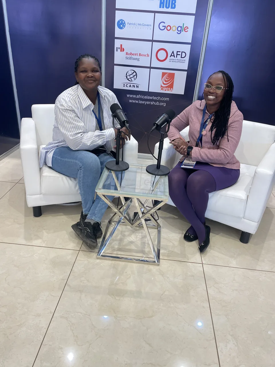Two participants in conversation at the Africa Law Tech Festival